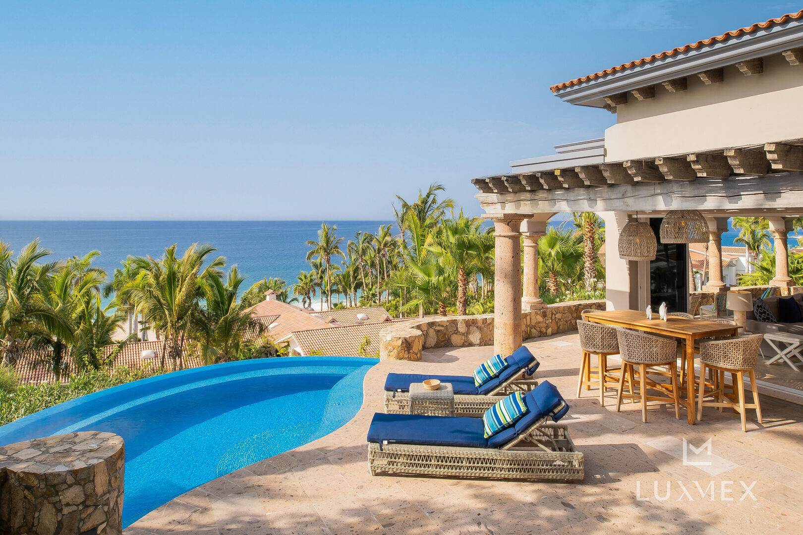 Views of the ocean and other surrounding homes from the pool of this Los Cabos Luxury Vacation Villa.