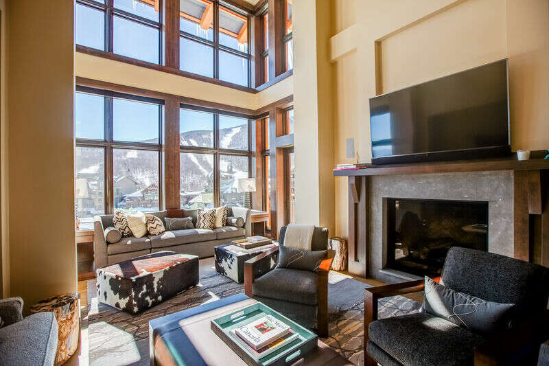 Slopeside luxury at its best! Location, location, location! There is something to be said about being in the right place at the right time and a stay at See What You’ll Ski will show you why.   This exceptional Lodge at Spruce Peak condo combines elegance and luxury with commanding views of Mount Mansfield from the floor-to-ceiling windows. The spacious interior is balanced with comfortable furnishings and an oversized gas fireplace in the living room, and an additional lounge space on the second level with a pool table, couches, and a TV for movie night. Chefs and foodies alike will delight in the ultra-modern kitchen with ample room for entertaining. Living slope side there is no need to tailgate, just head up to your deck and BBQ grill for après festivities—the bonus view of the mountain is great for swapping stories of the runs of the day! Of the four bedrooms, two king suites and a room with two queen beds are located on the main floor with the final being a large kid-approved bunk room upstairs. Bonus amenities include the heated garage space for your vehicle and ski valet services for your gear.   You literally can’t be any closer to all the adventures the mountain has to offer. Winter, spring, summer, or fall, there are activities to interest all. Beyond skiing and snowboarding, you can enjoy live music and a whiskey bar at the Whistle Pig Pavilion, restaurants, shopping, a climbing wall, kids camp, sledding, and outdoor ice skating in the winter and hiking trails and a weekly farmer’s market in the summer.  *All Lodge at Spruce Peak Properties are subject to 4% Activity Fee, and access to the Community Amenities is available for a separate fee.