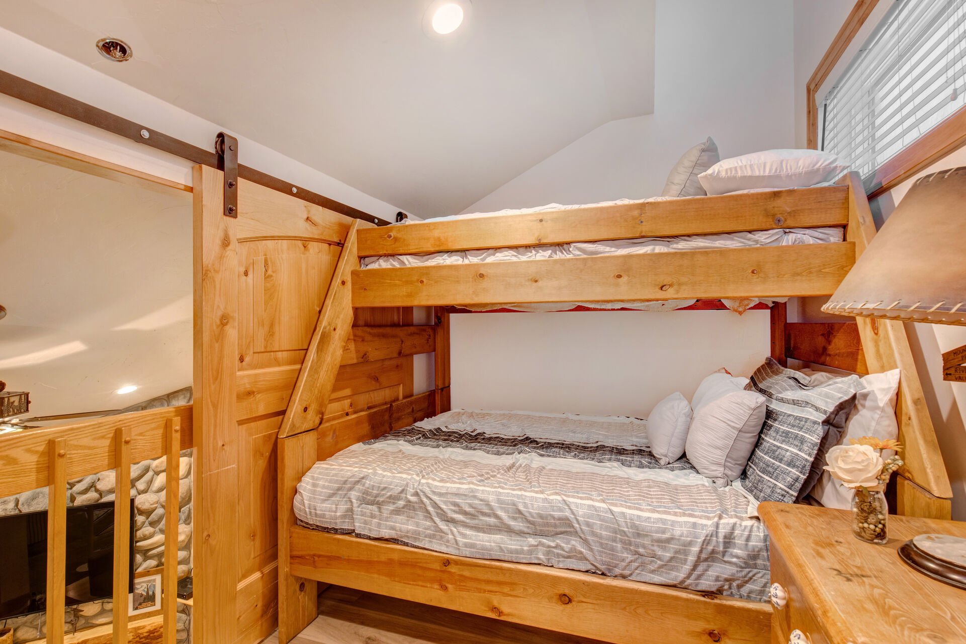 Upper Level Bunk Room with Twin over Full bunk bed, and access to a full shared bath with a tub/shower on the lower level
