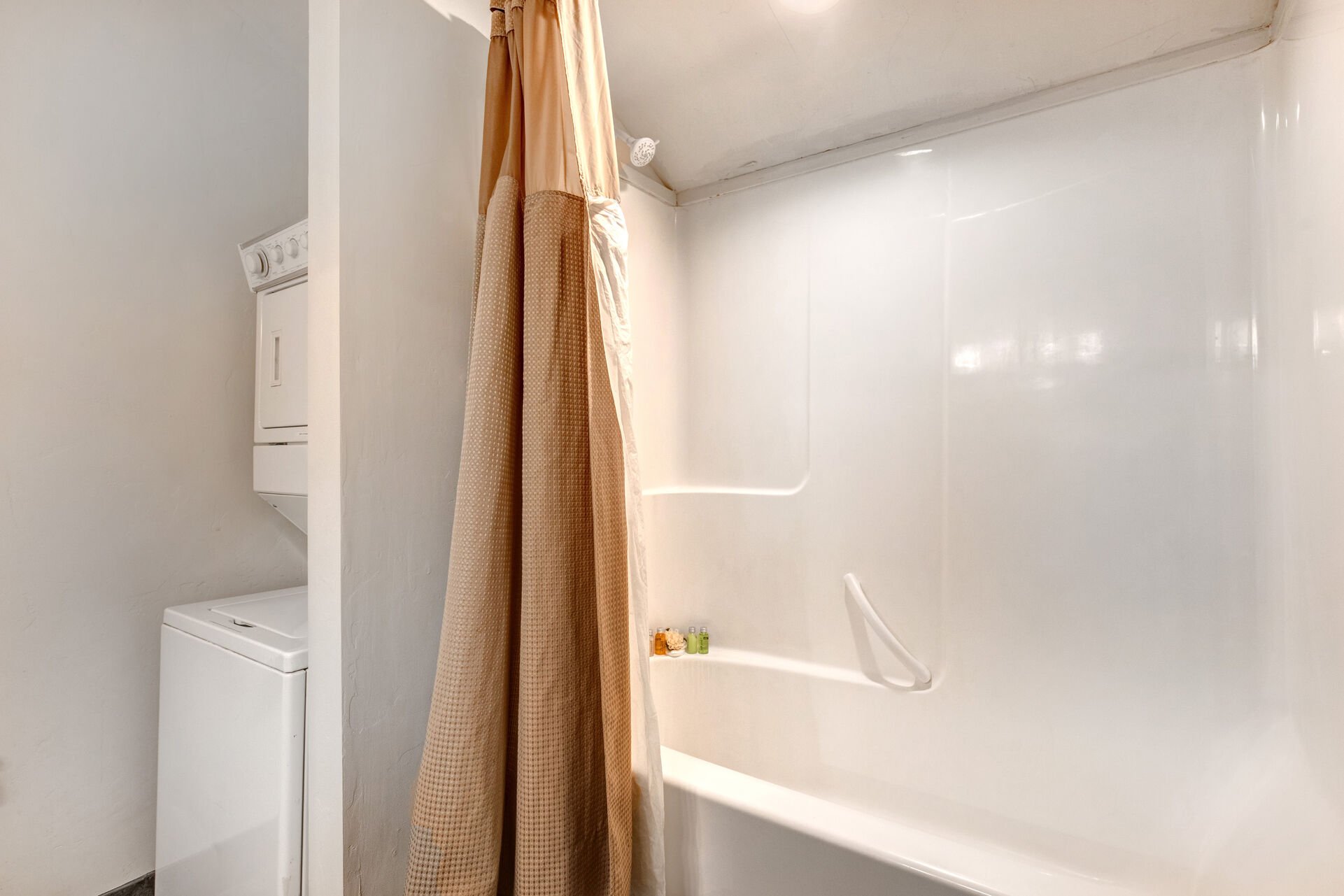 Main Level Shared Bath with double sinks, tub/shower combo, and private laundry units