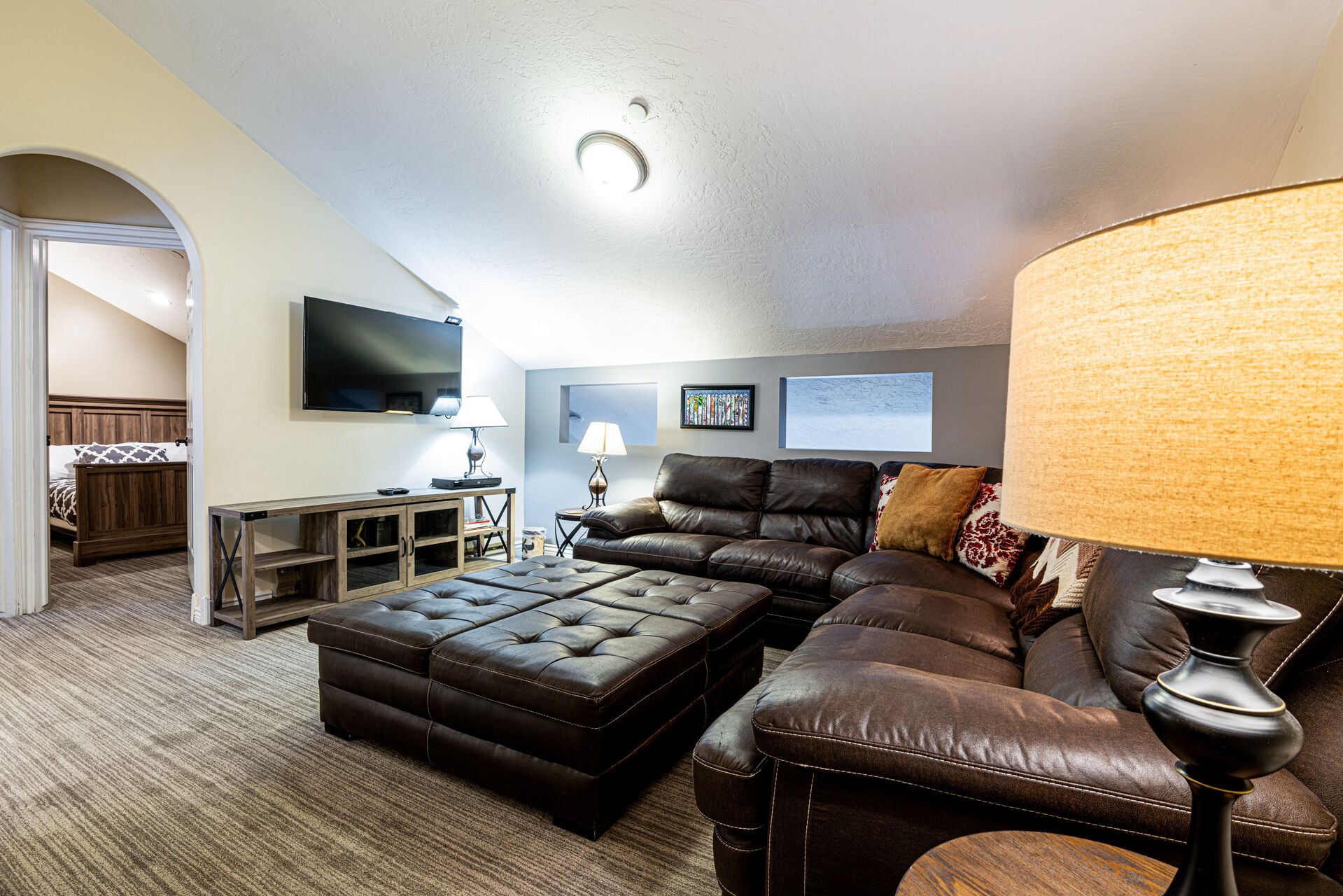 Upper Level Family Room with a Comfortable Sectional Sofa and TV with Cable
