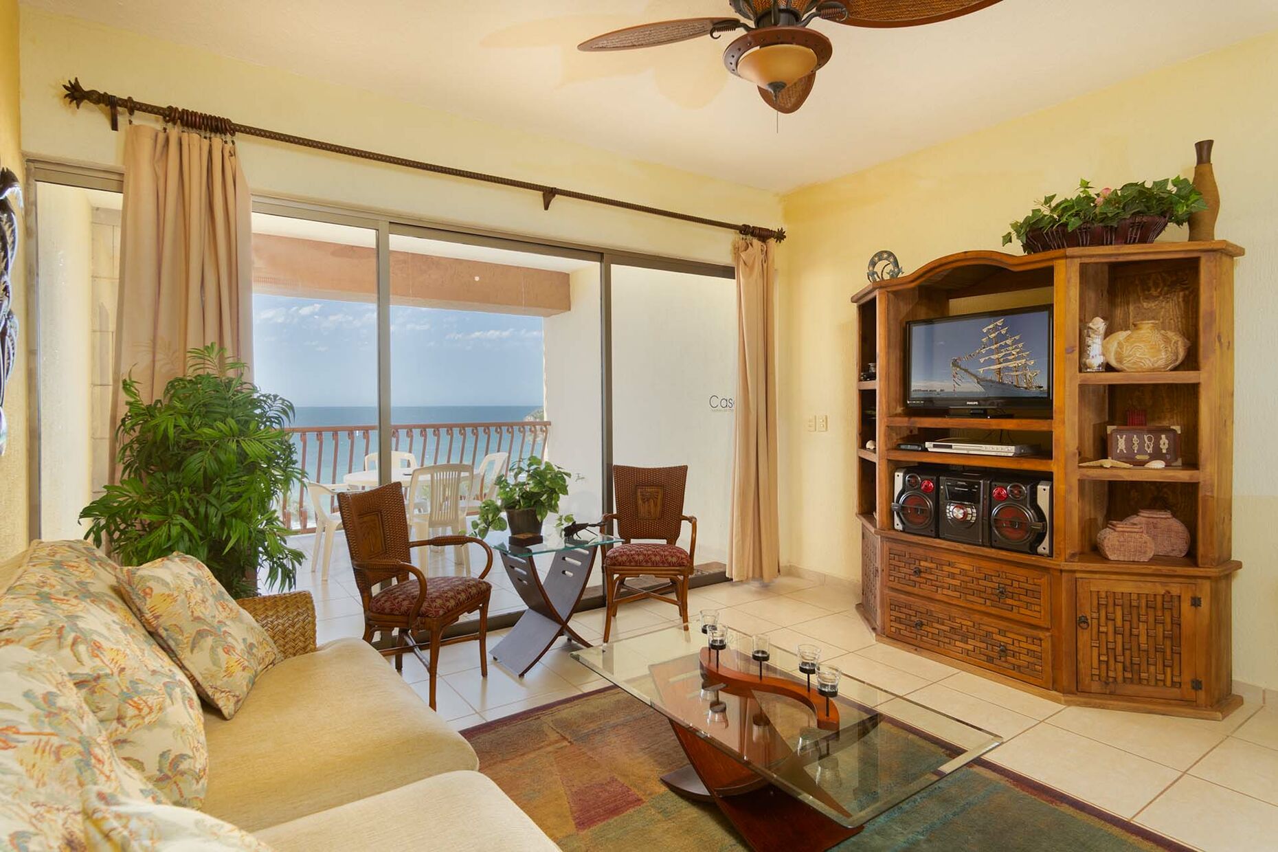 SW 411 has a warm, inviting living room with comfortable seating, and an entertainment center.