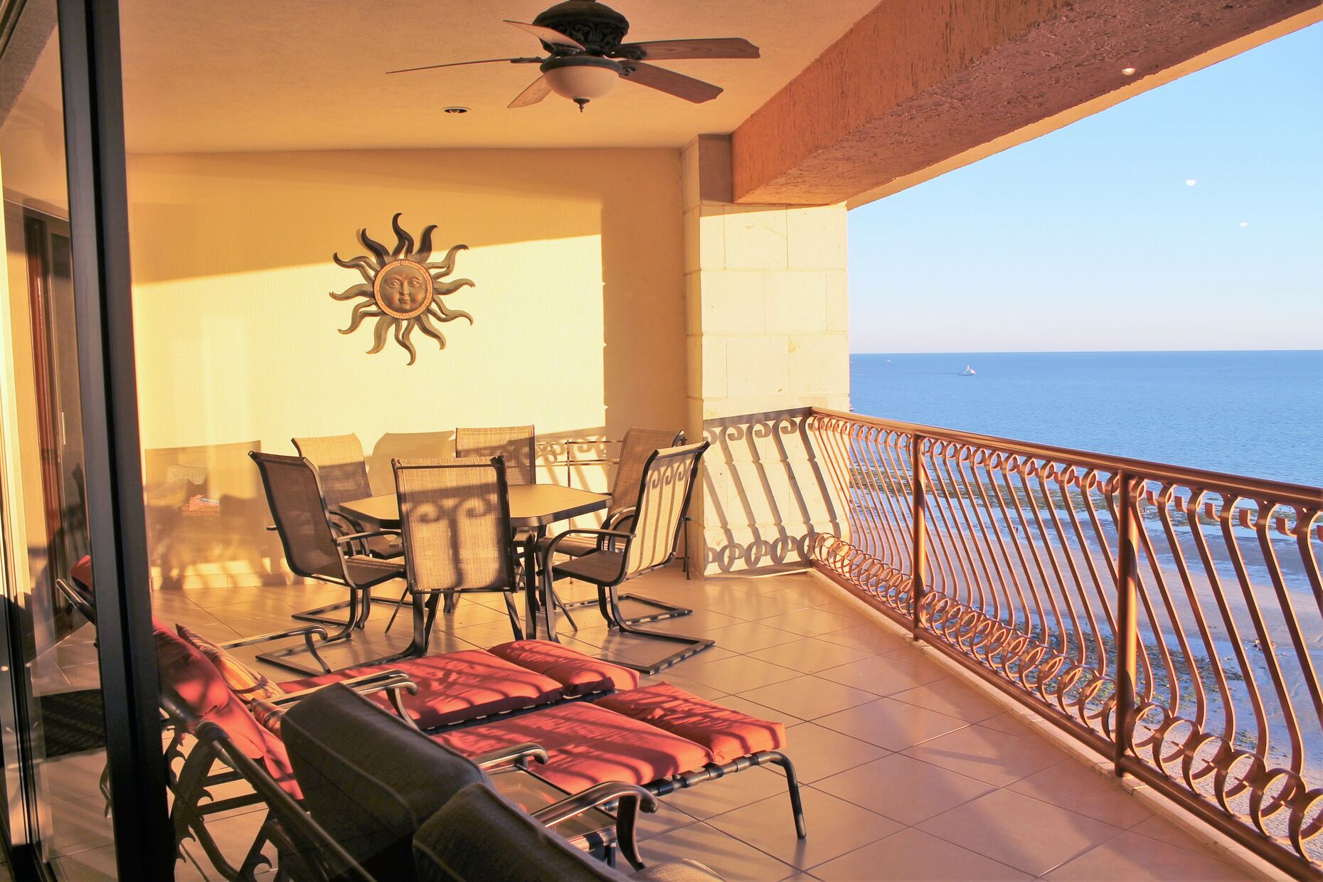 Balcony - outdoor dining table, chaise lounge chairs and plenty of seating.