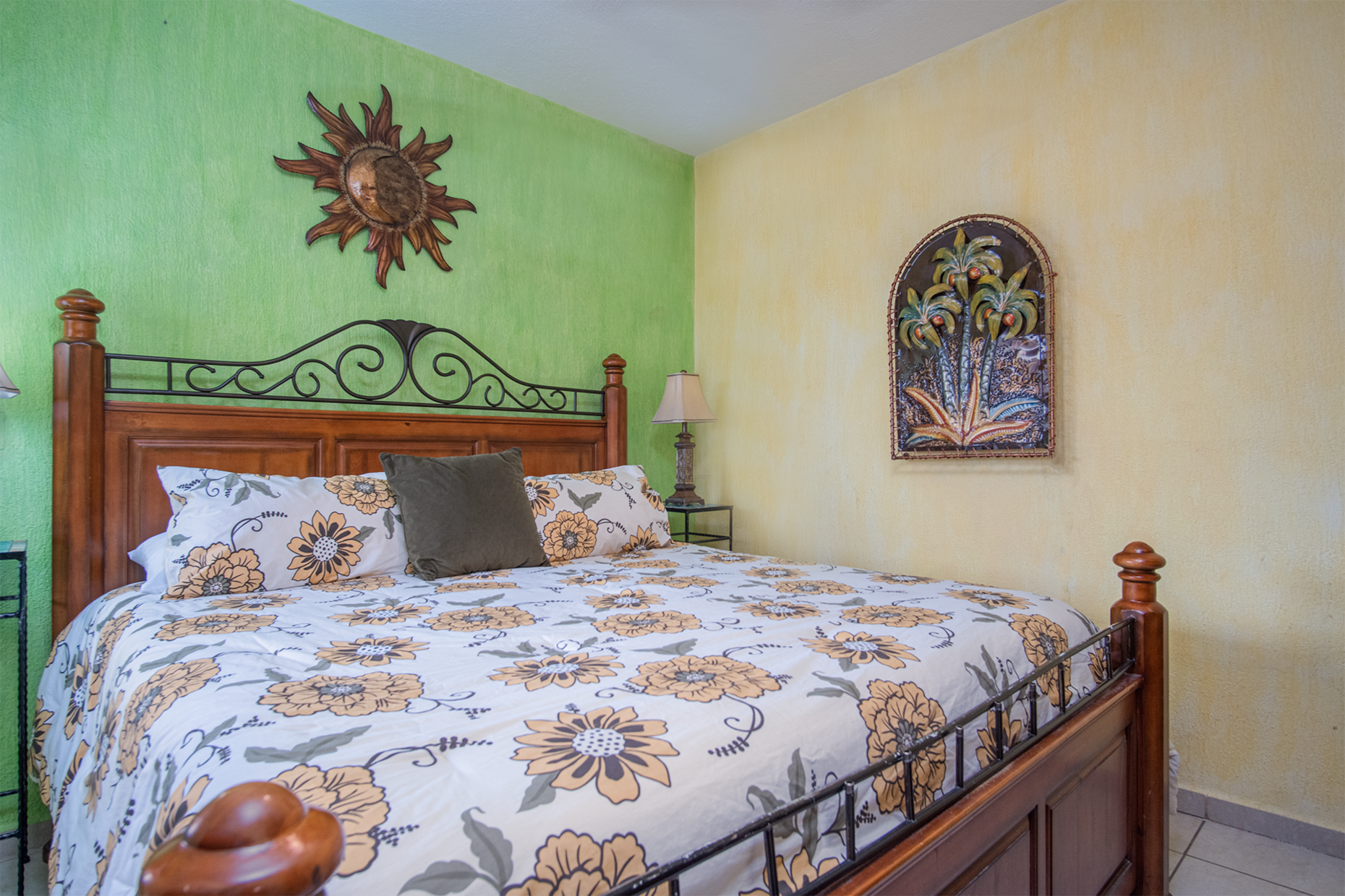 King bed in the colorful guest bedroom