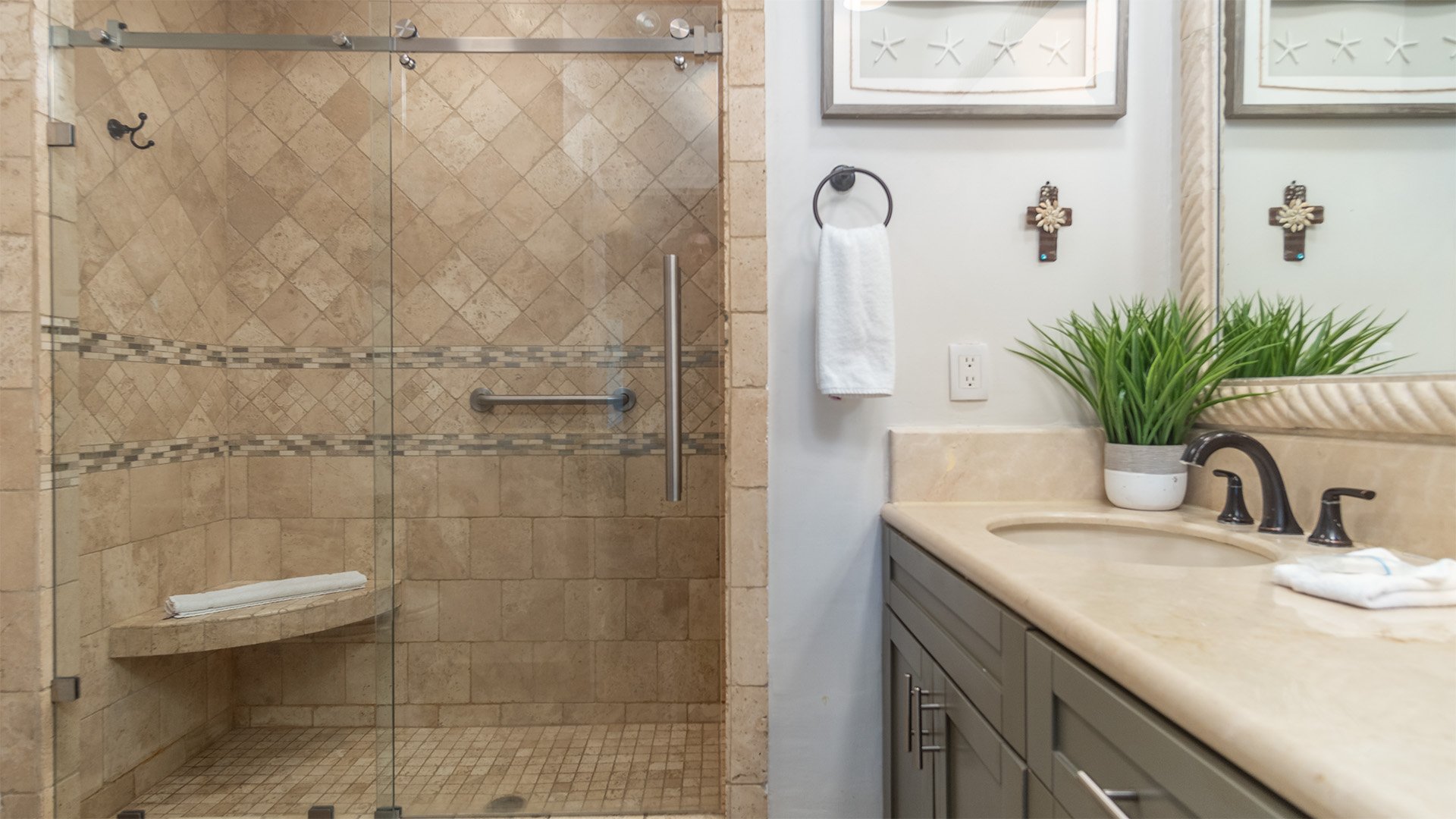 The master bathroom with its enclosed shower and vanity.