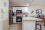 The kitchen is fully appointed with all appliances small and large, along with cookware, and dinnerware.
