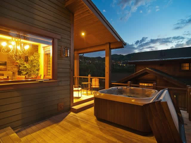 Large Private Deck with a Hot Tub, Seating and Mountain Views