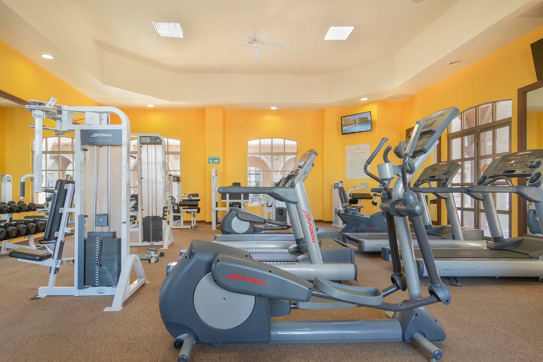 The workout room is fully stocked with weights, machines, as well as aerobic equipment.