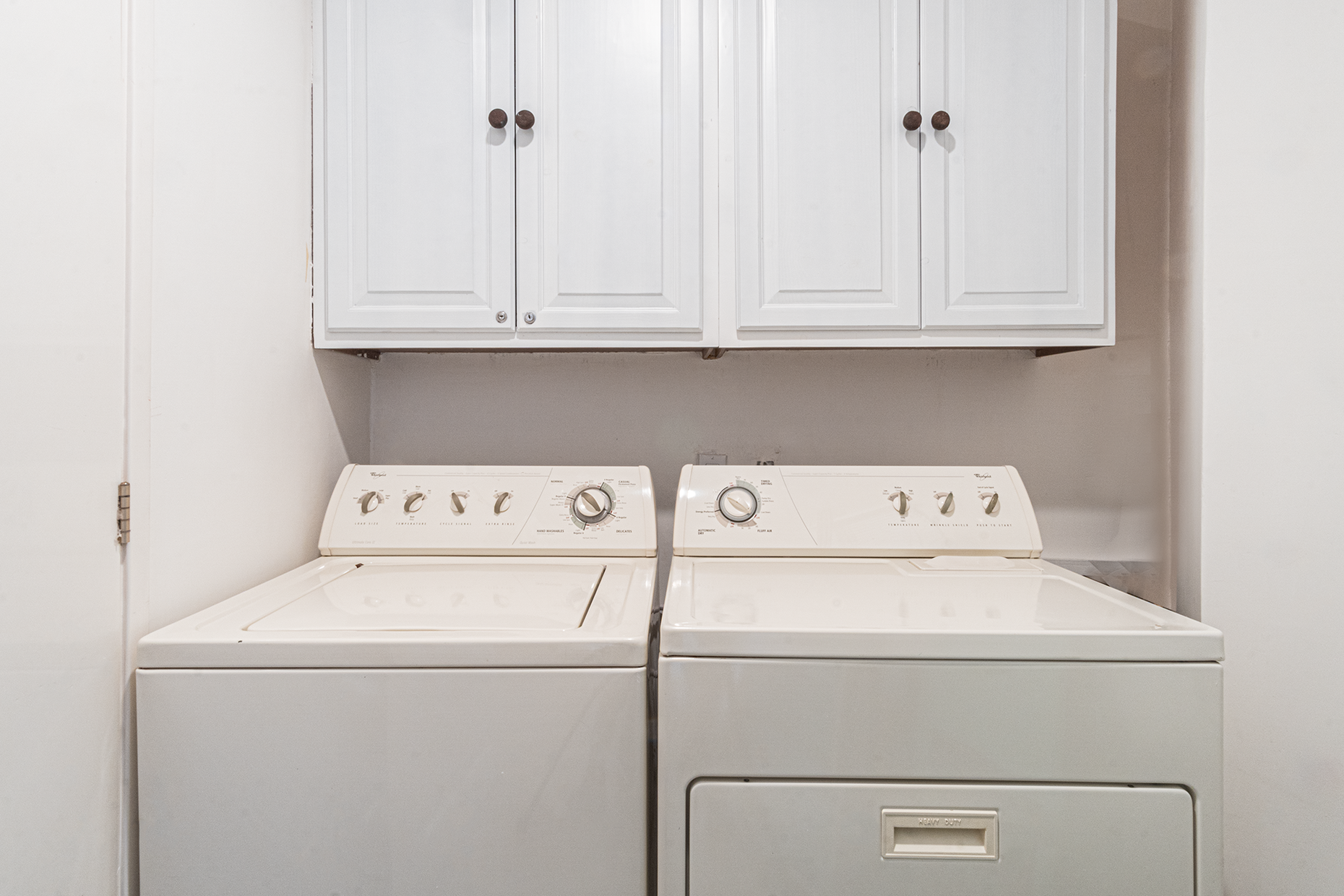 There is a separate utility room as you enter the unit, which has a full sized washer and dryer.
