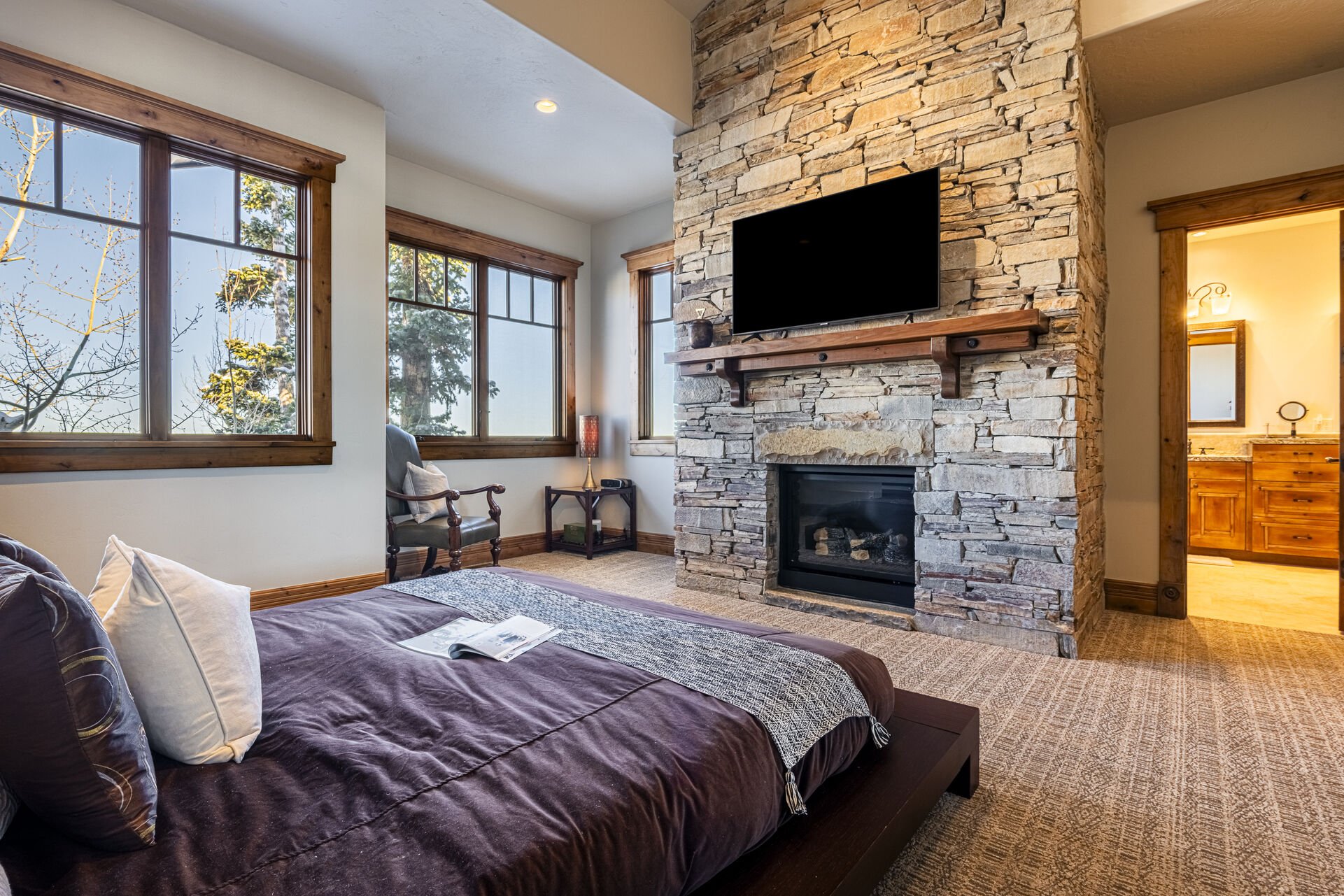 Main Level Grand Master Bedroom with Smart TV, Gas Fireplace, and En Suite