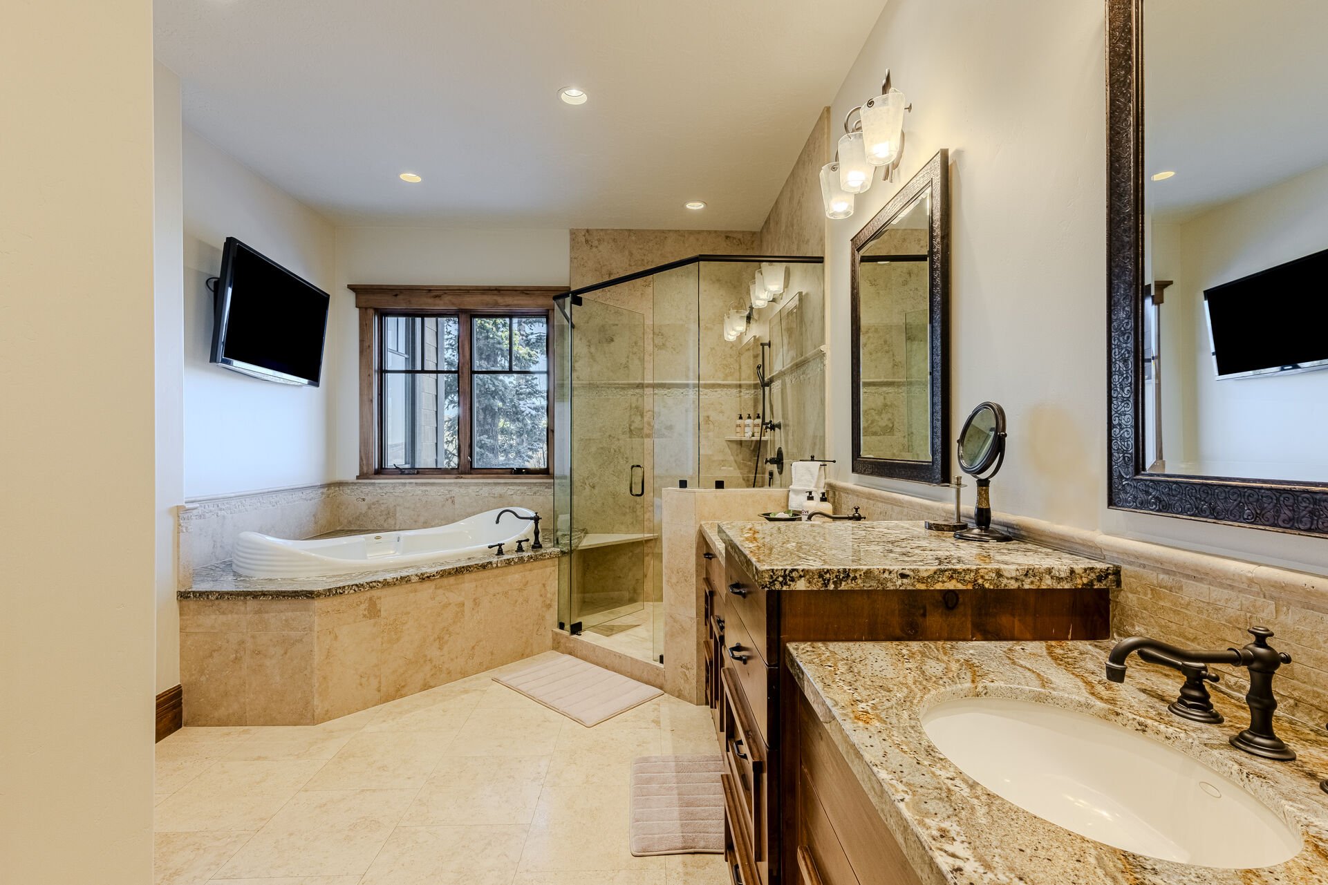 Master Bathroom with Roman Jetted Tub, Stone Shower, Two Vanities, and Walk-in Closet