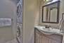 View of hall bathroom with shower, toilet, sink and full-size washer/dryer in Snowblaze 208 - Park City
