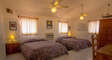 The upstairs suite has two queen size beds, a twin size sofa bed and its own bathroom