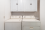 There is a separate utility room as you enter the unit, which has a full sized washer and dryer.