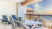 Drinks on the dining table; the balcony is really a highlight of this three bedroom condominium.