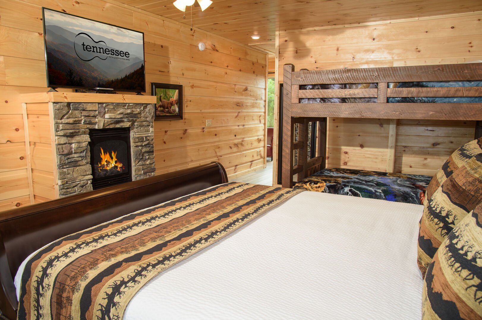 Bedroom with TV, Fireplace, Bunk Beds king size beds, & private bathroom