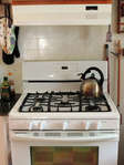 Cooking is optional. But if you do, enjoy 5-burner stove and all accoutrements to meet your cooking and baking needs.