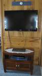 FLAT SCREEN HD TV WITH NEW ENTERTAINMENT TABLE