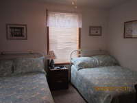 Second Bedroom has two double/full beds, bureau and night stand with additional drawers, and room to hang clothes. A ceiling fan, air conditioner and a 32