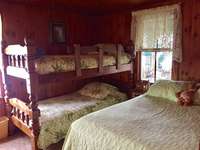 Bedroom with full bed and bunk beds