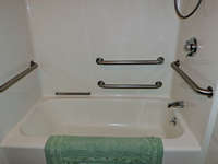 Full shower with handrails with attachable seat