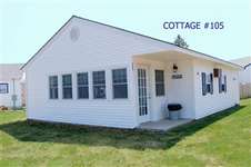 Welcome to cottage #105. Our cottage includes a recently renovated three season porch, two bedrooms, one and a half baths, and a comfortable living room kitchen combination.