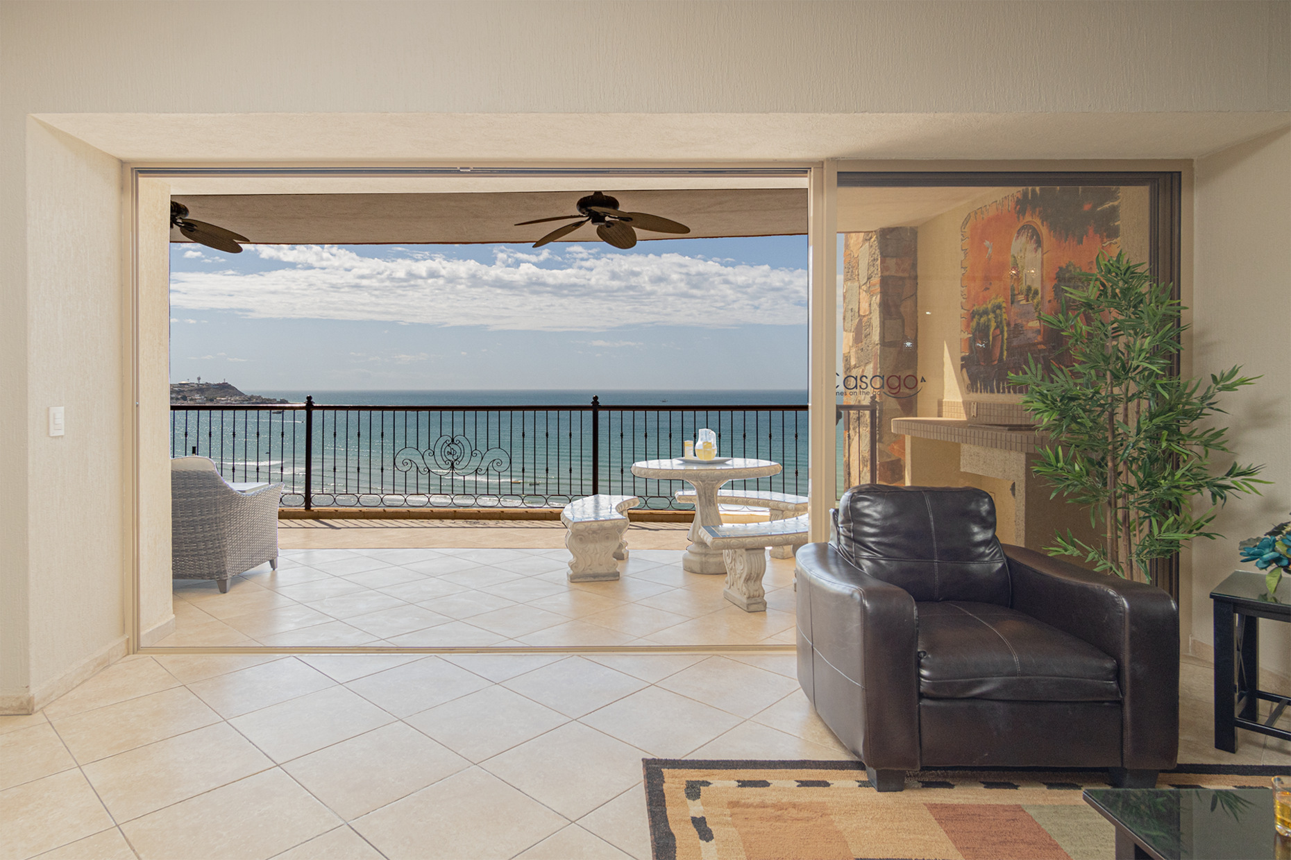 The sliding door to the patio opens to let the beach inside!
