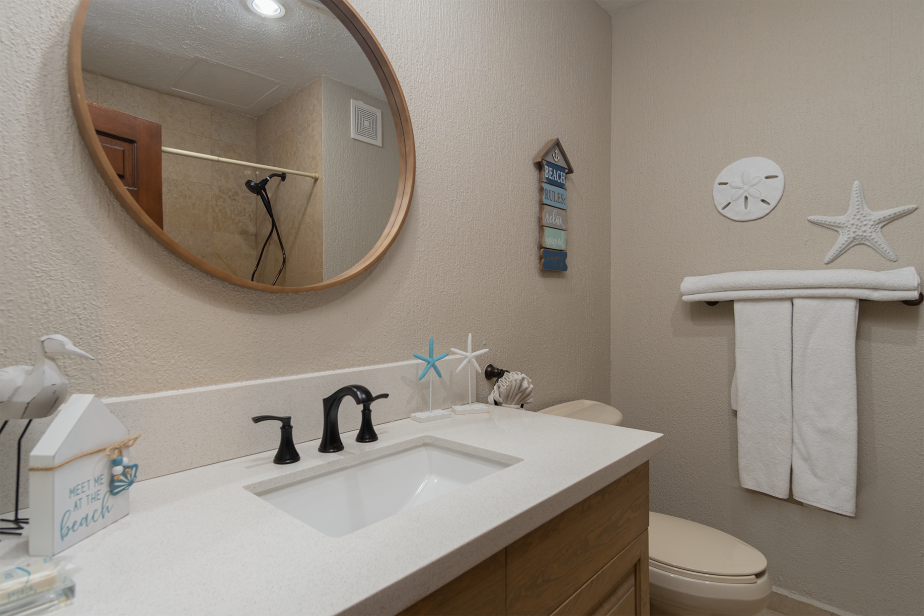 The guest bath with vanity and shower is in the hall of of the Guest bedroom.