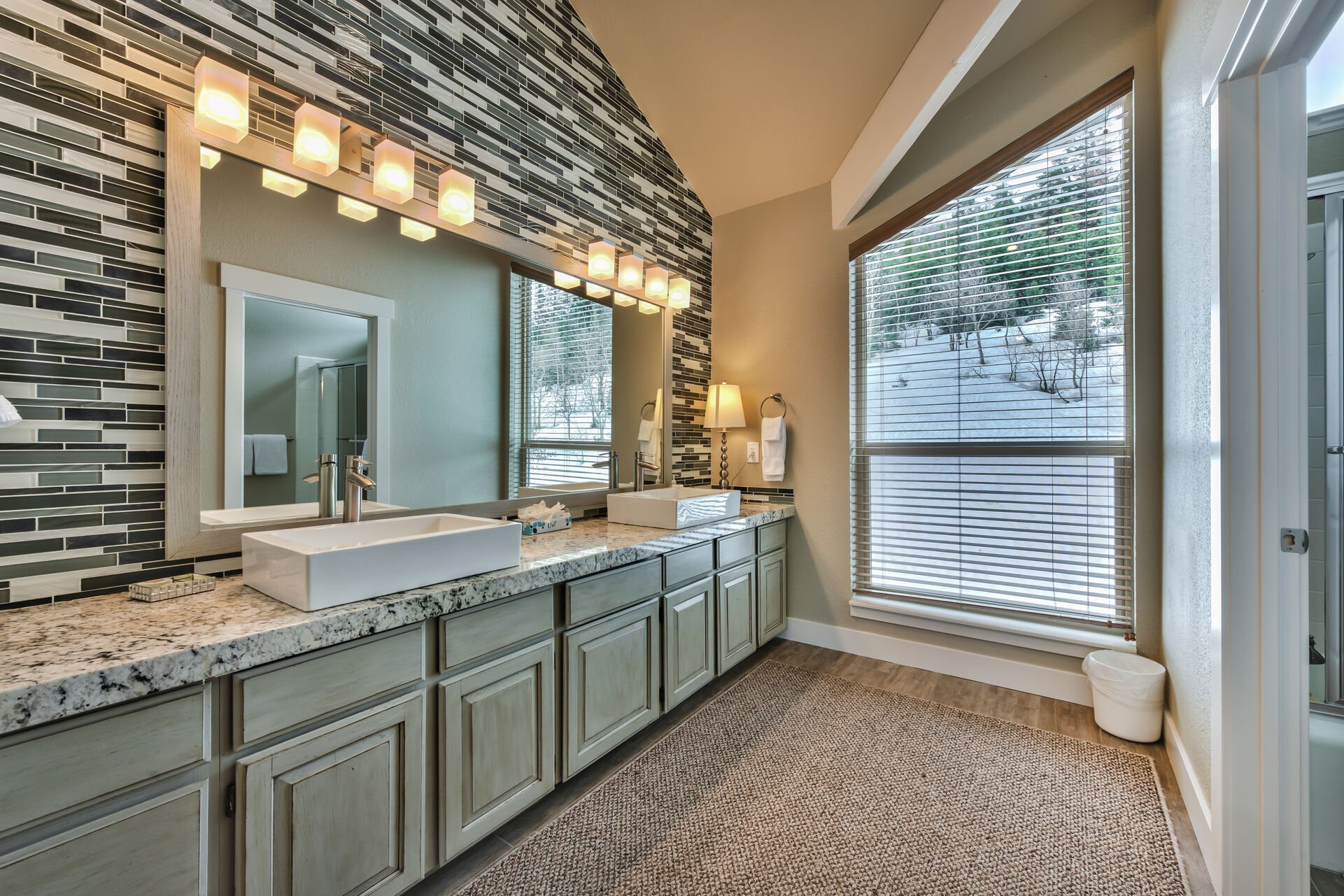 Master Bath  vanity with granite counters, dual vessel sinks and tub/shower combo