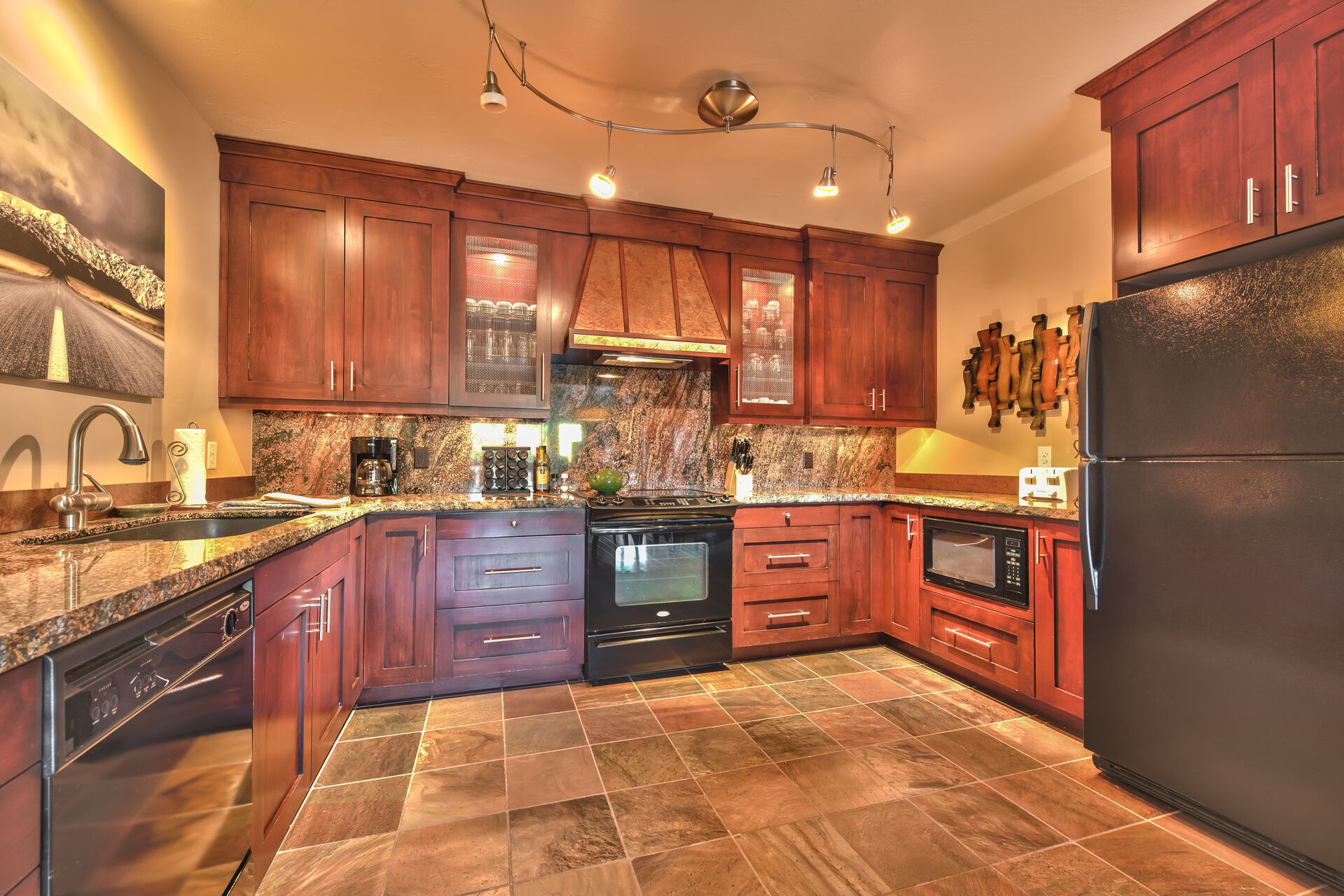 Kitchen with granite counter tops and new appliances