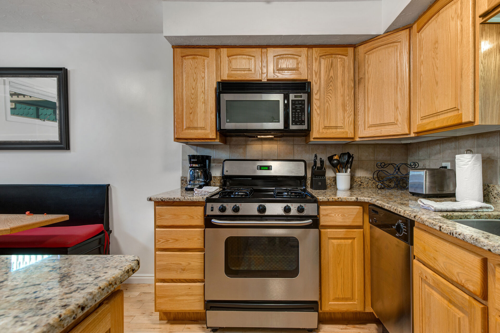 Fully Equipped Kitchen with Stainless Steel Appliances, Granite Countertops and Bar Seating for 2