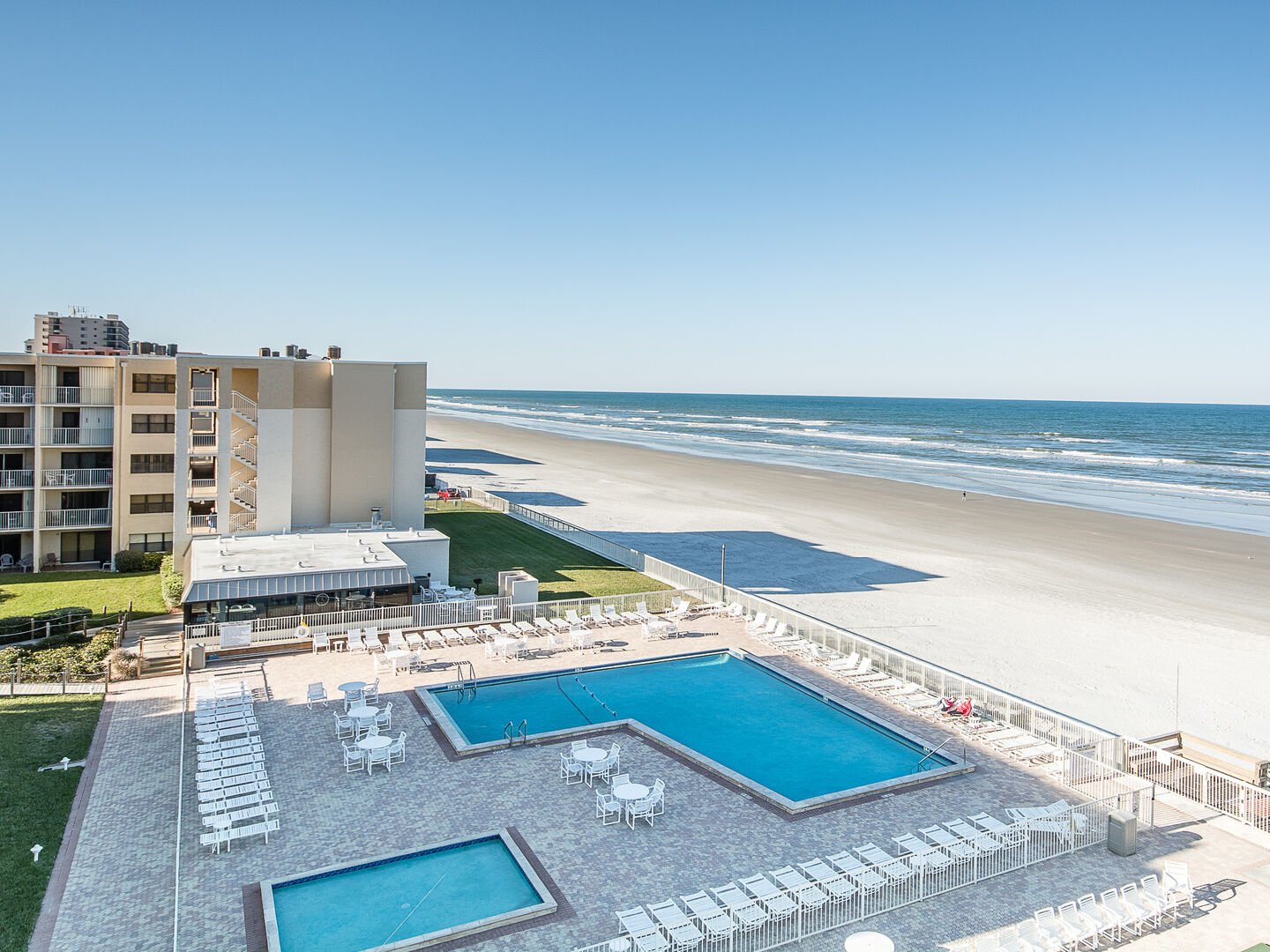 Oceanfront Pool Area at New Smyrna Beach Condo Rental