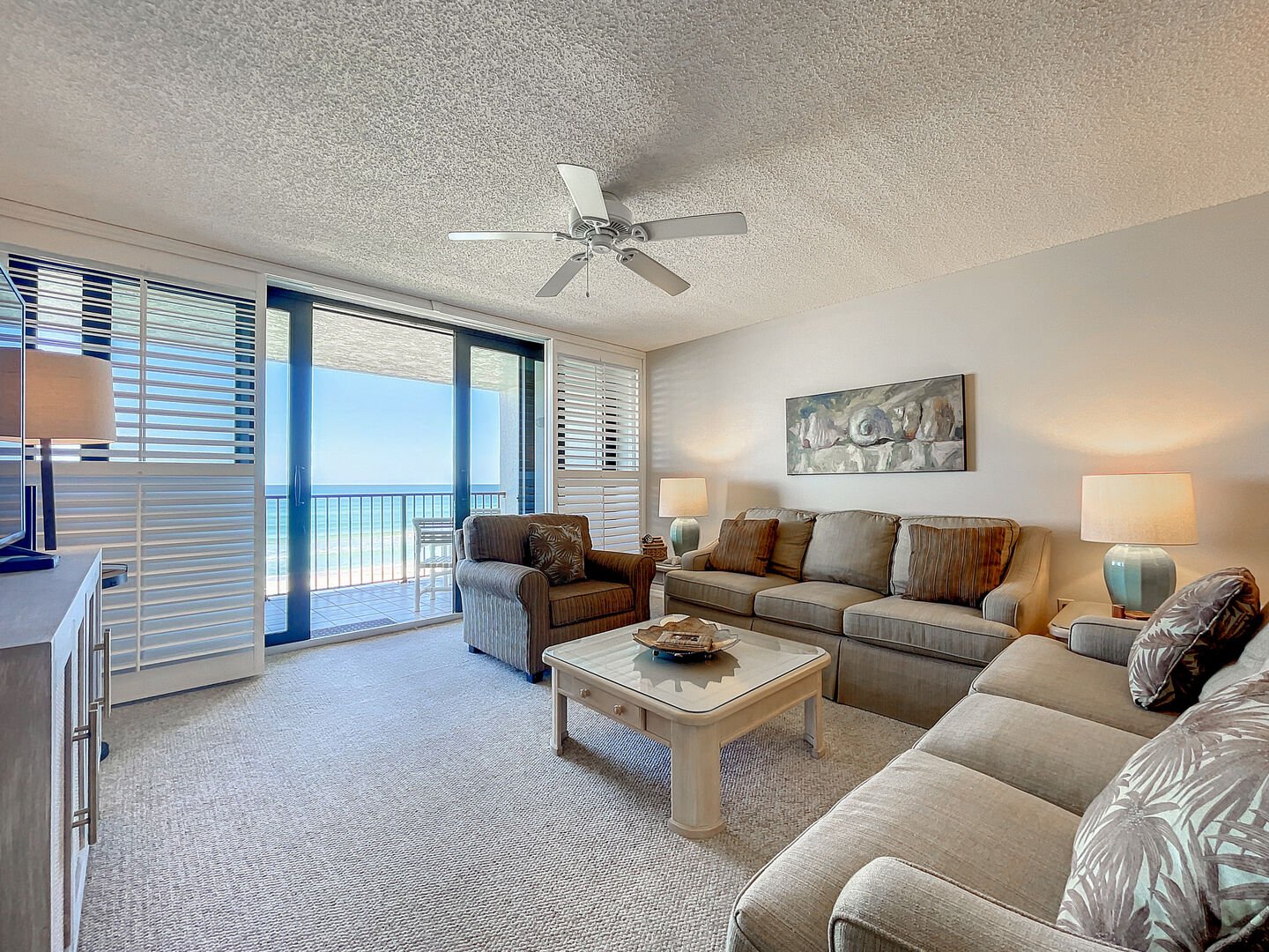 Oceanfront living room featuring a flat screen TV, DVD and recliner.