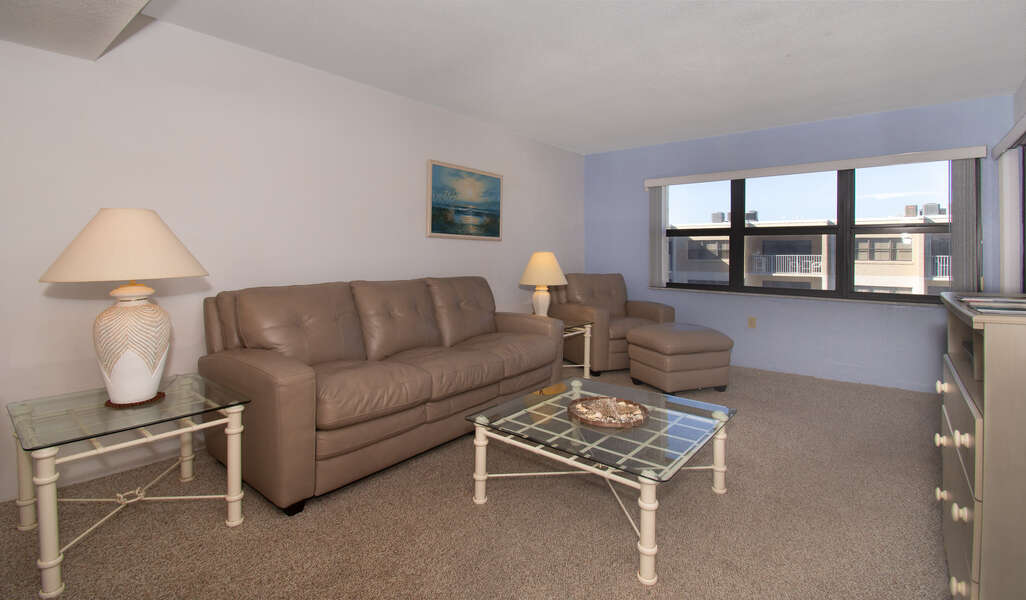 Living Area with Sofa and Lounge Chair at New Smyrna Beach Condo Rental