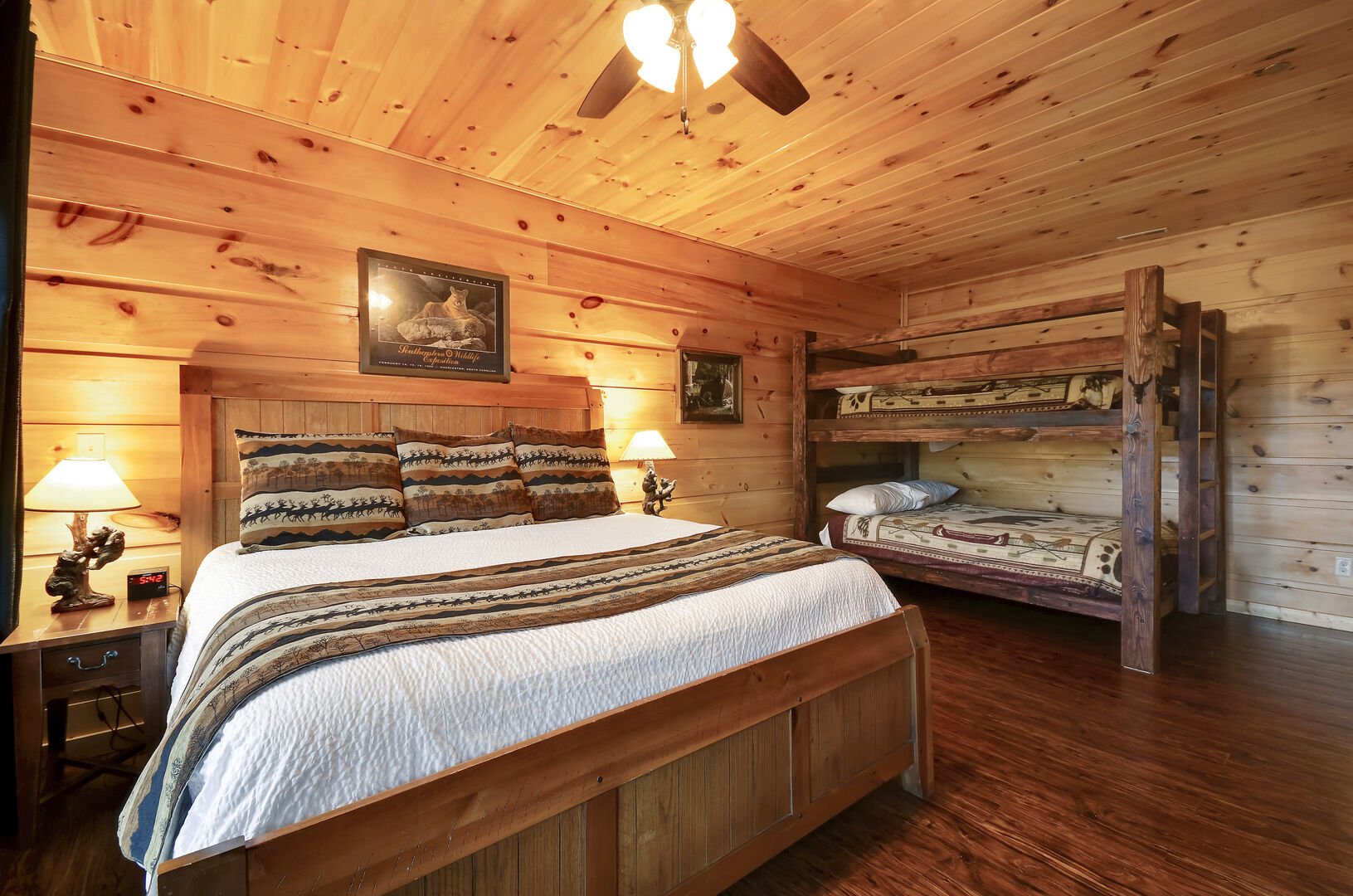 Spacious Bedroom Includes a Large Bed and One Bunk Bed.