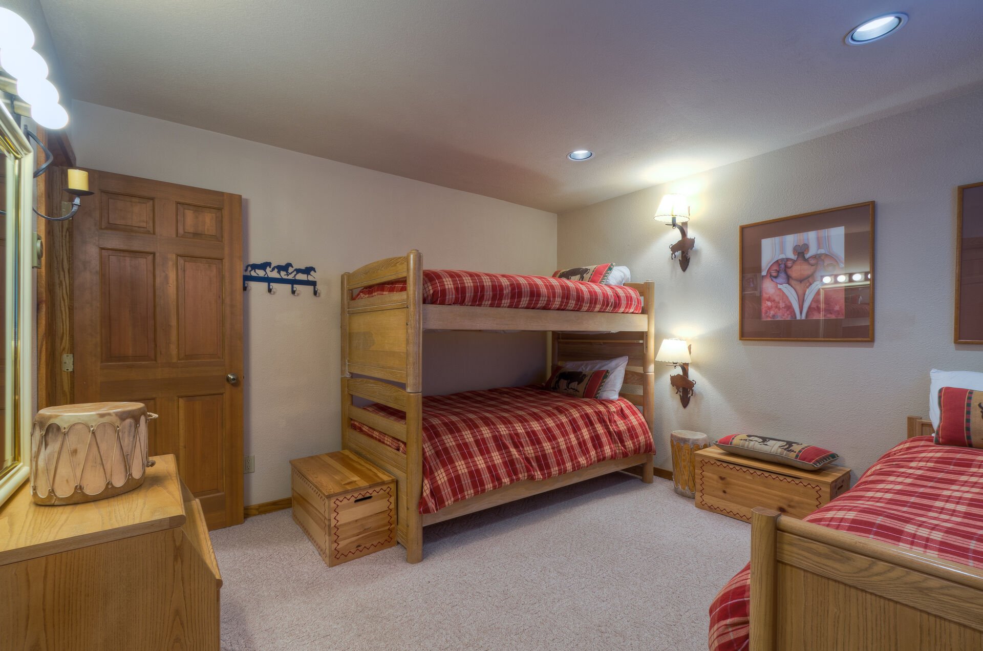 Bunk beds and a single bed with a trundle twin under the single bed.