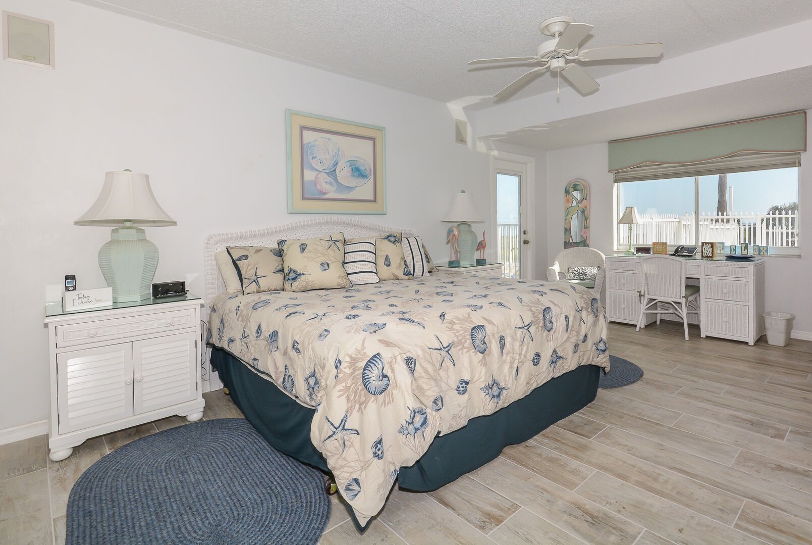 Spacious, ocean view master bedroom with king sized bed, TV, desk, access to patio and private bath.