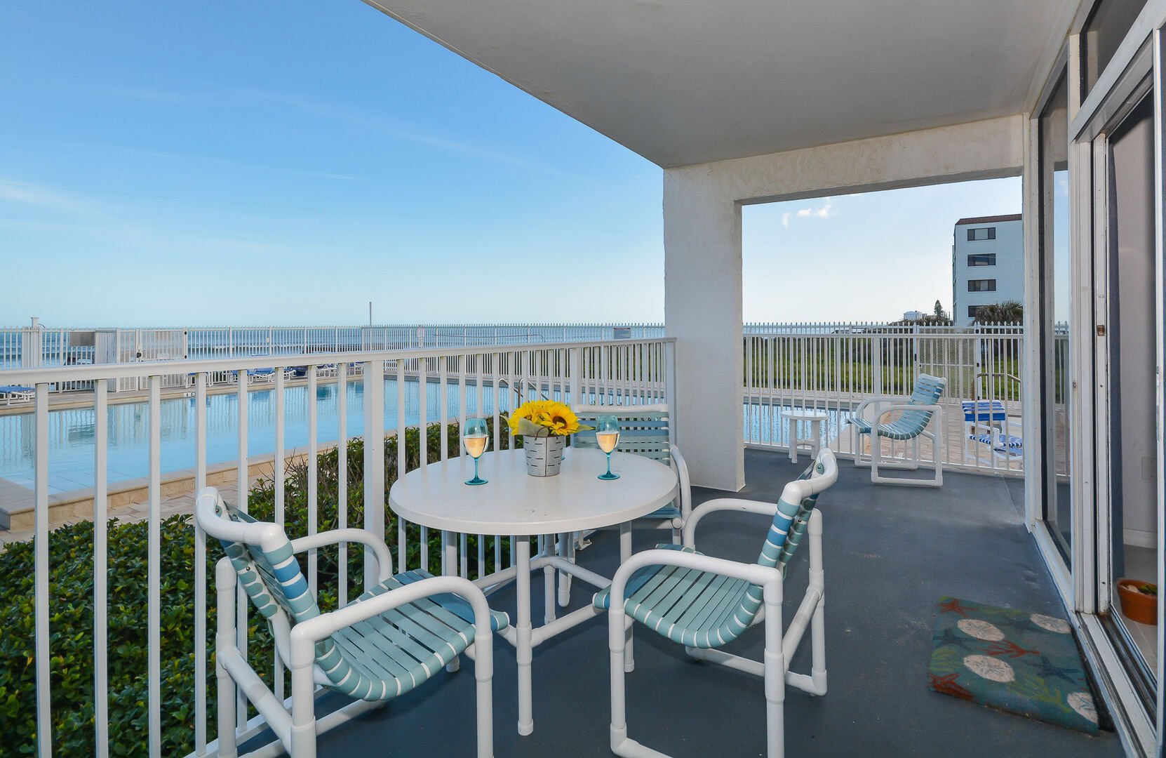 Escape the sun and relax on the oceanfront patio overlooking the pool area.