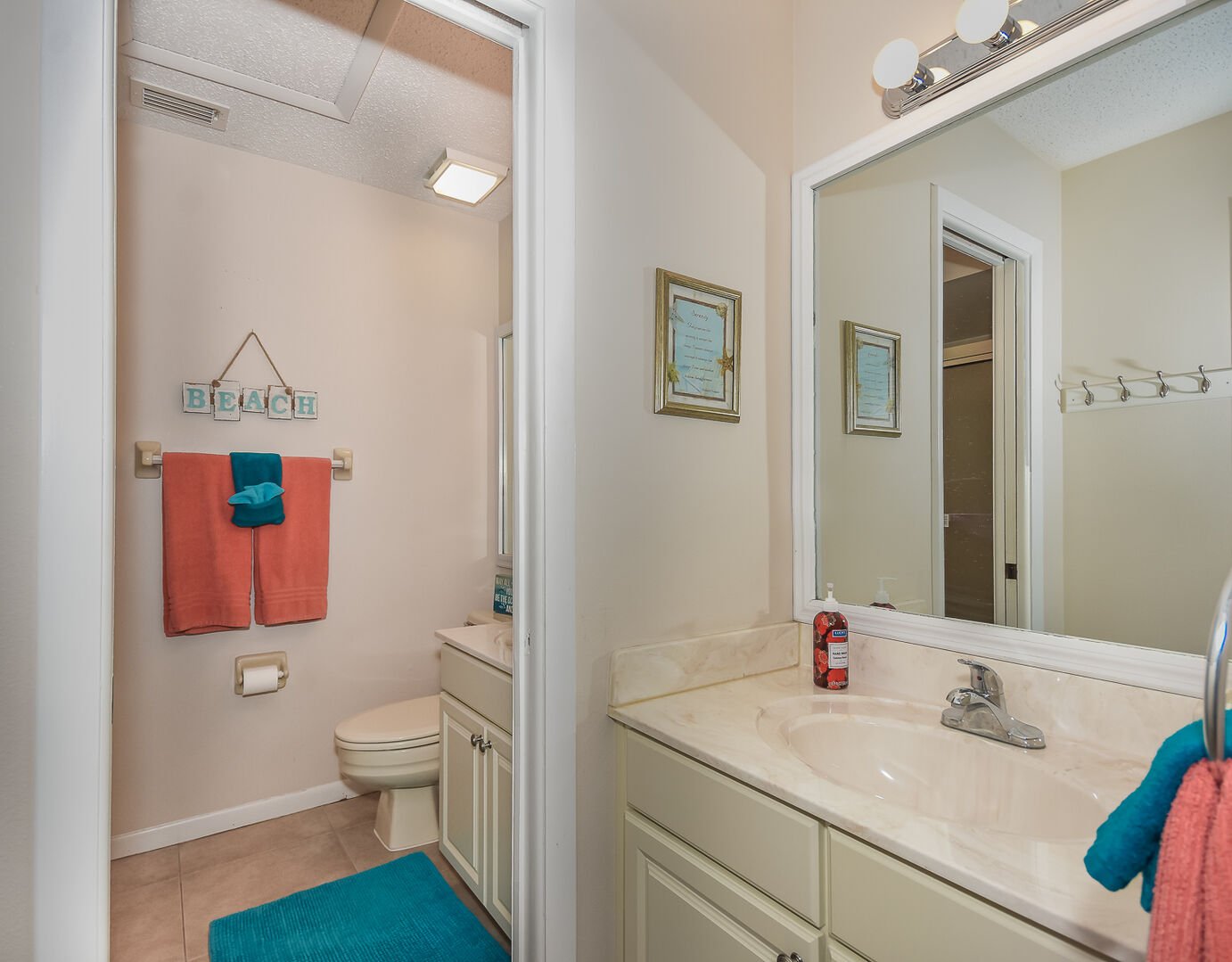 Private master bath features a vanity and his/her sinks.