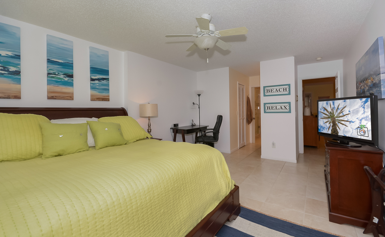 Master bedroom with access to the patio, king size bed, flat screen TV and private bath.