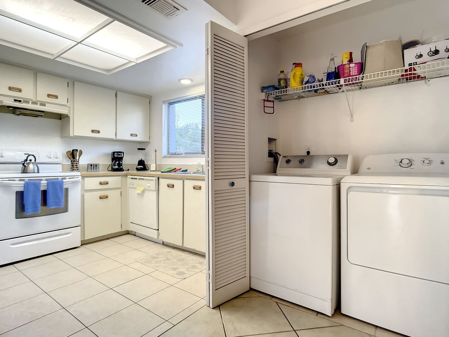 Laundry room with a full sized washer/dryer.