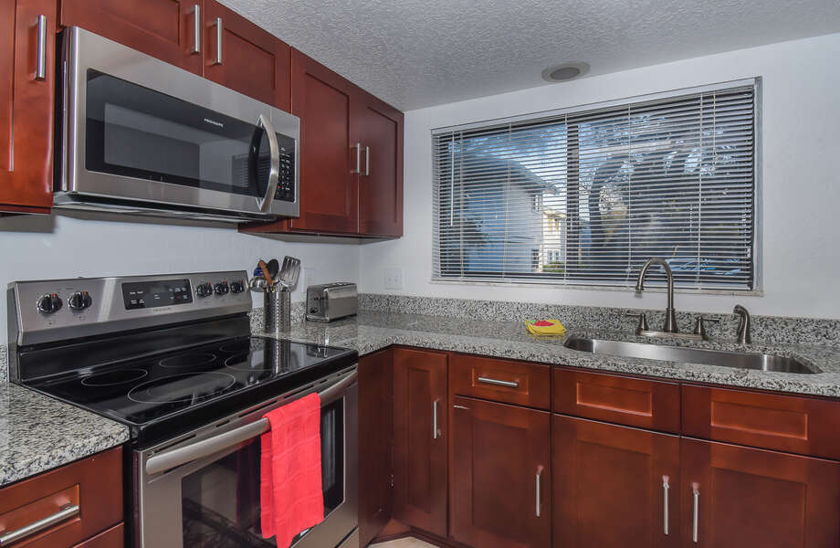 This New Smyrna Beach vacation rental features an updated kitchen with stainless steel appliances.