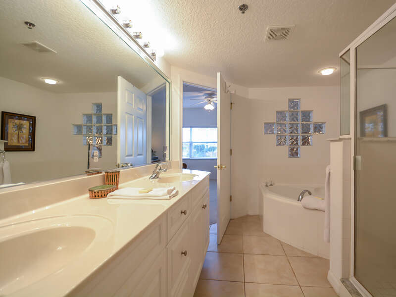 Master bath with his/her sinks, walk-in shower and garden tub.