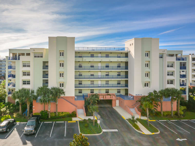 Exterior view of Ocean Walk 16-603 with Palm Trees