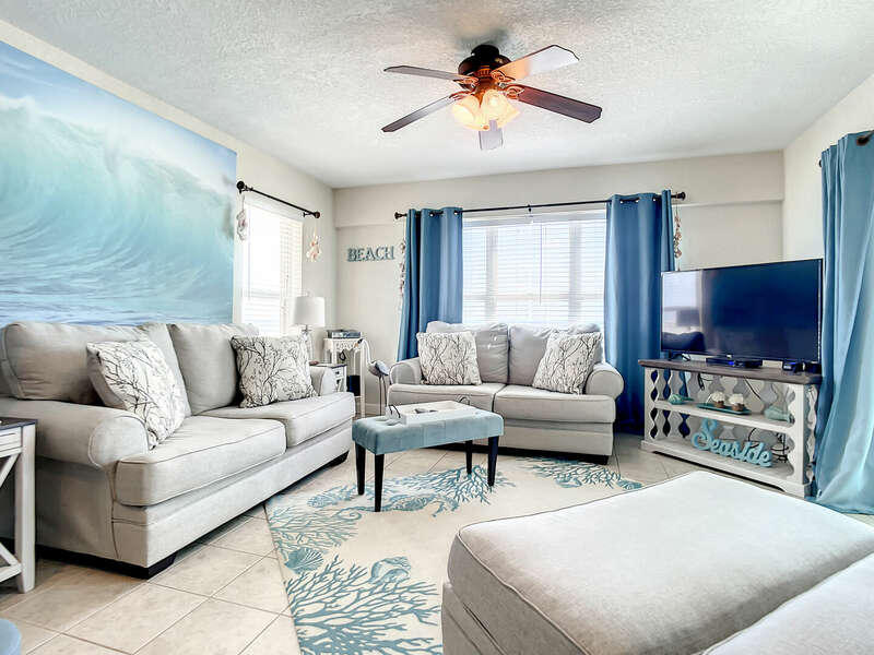 Spacious, Oceanfront Living Room with Flat Screen TV, DVD and Wrap Around Couch.