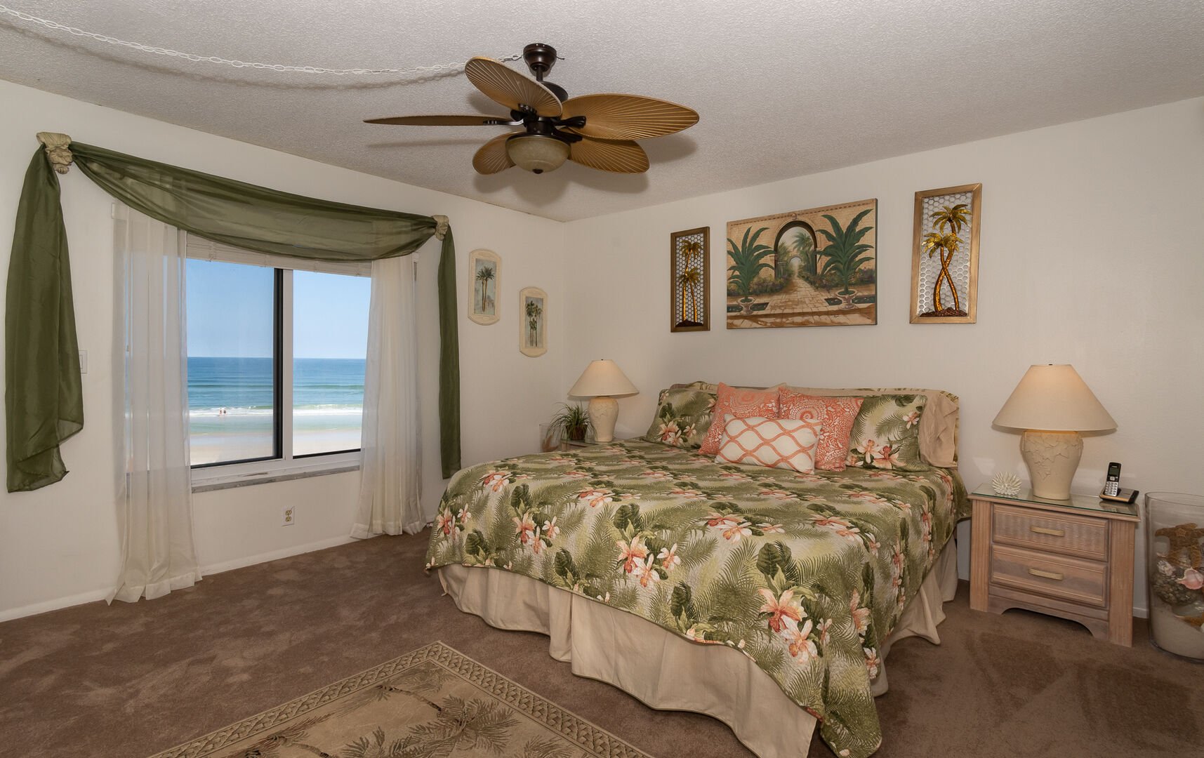 Spacious, oceanfront master bedroom with king size bed, flat screen TV and private bath.