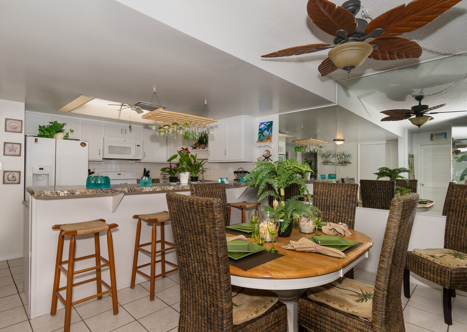 Ocean view dining room with seating for 6; with additional seating for 4 at the kitchen counter.