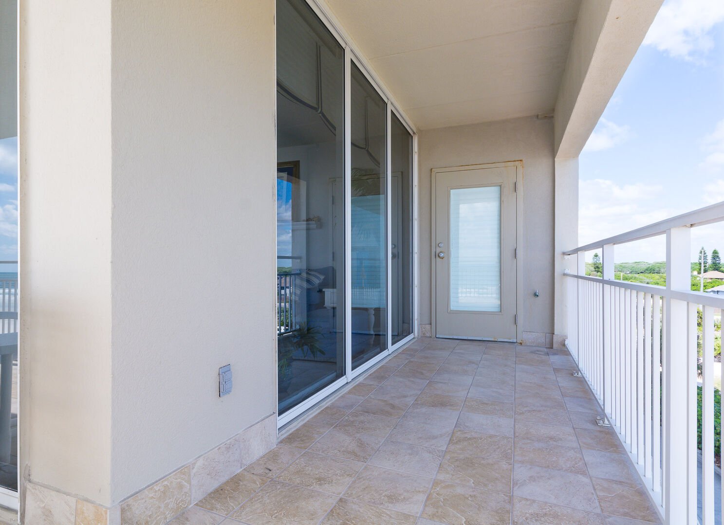 Wrap around porch at this Oceanfront condo in New Smyrna Beach FL.