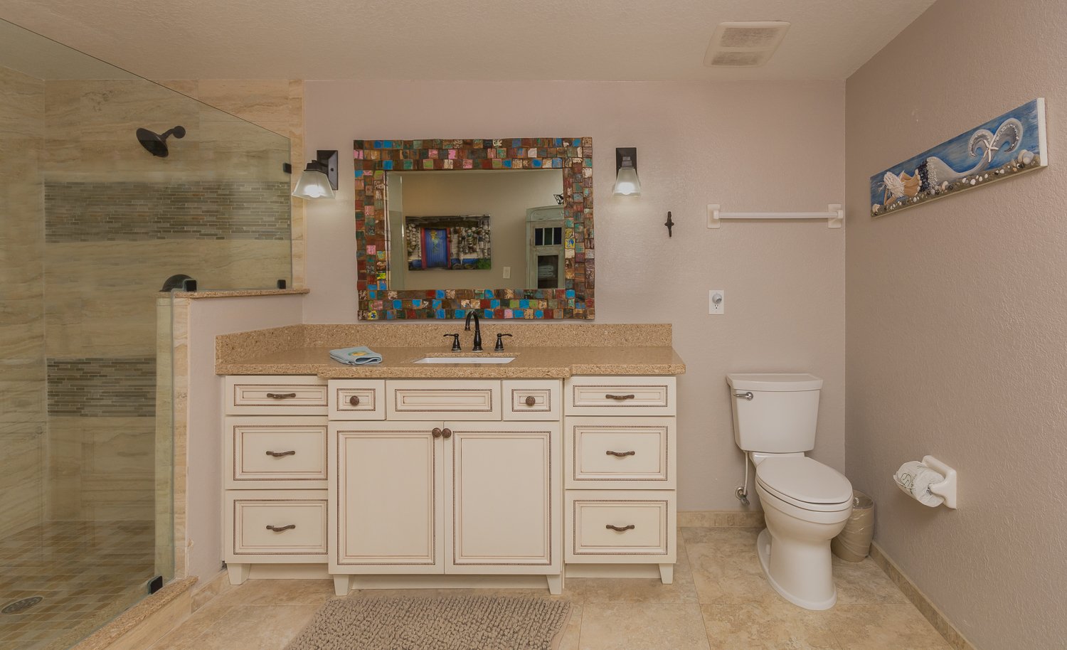 Bathroom with mirror and nearby toilet.