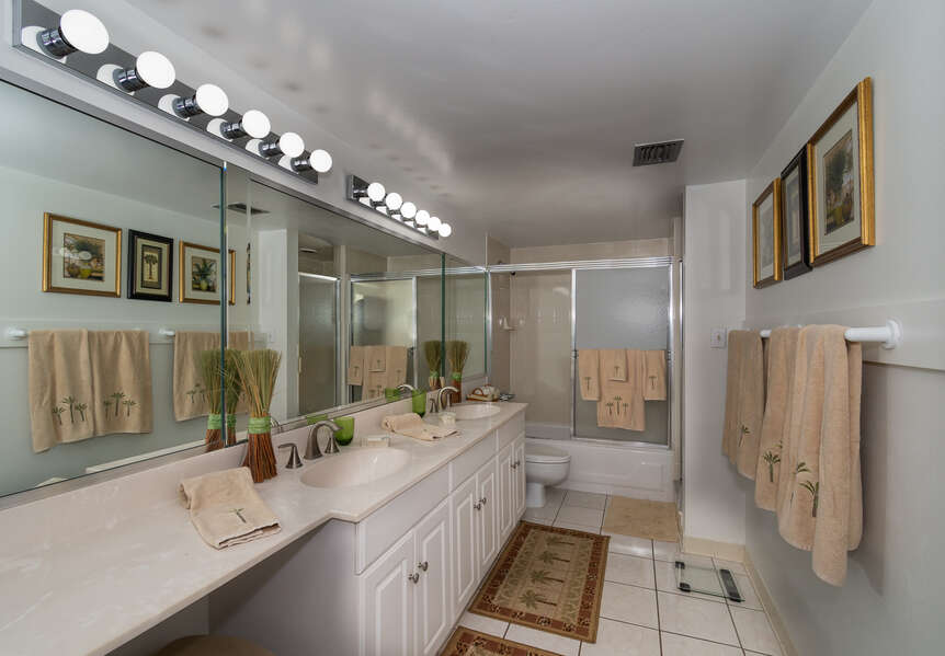 Private master bath with his/her sinks, walk-in shower, walk-in closet and tub/shower.